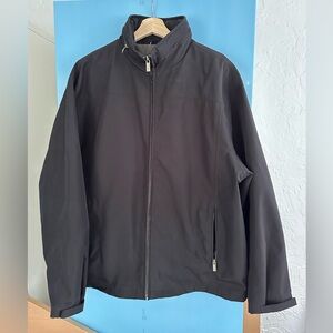 Weatherproof Men Jacket in Black Size L. Zippers and Hoodie tucked into collar.